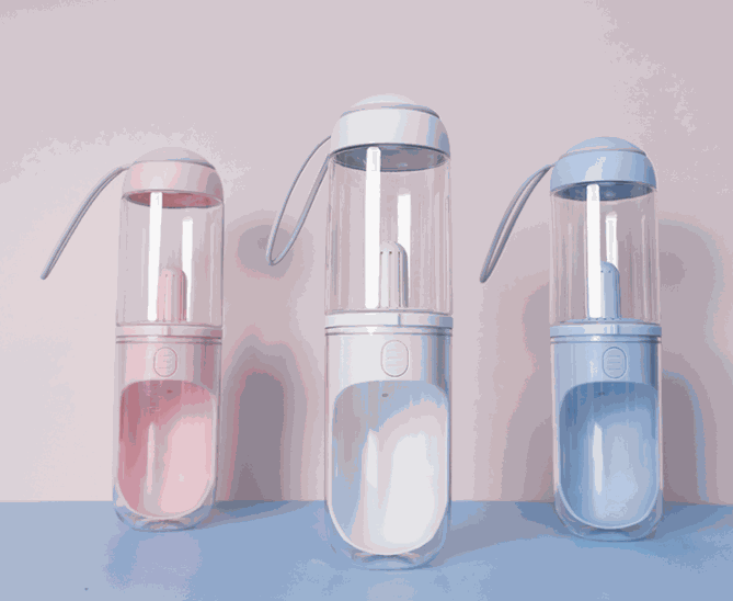 Portable outdoor travel pet water dispenser with silicone strap and transparent bottle